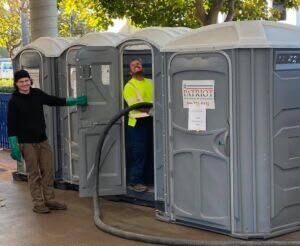 Modern blue restroom trailer staged for delivery in Miami Beach
