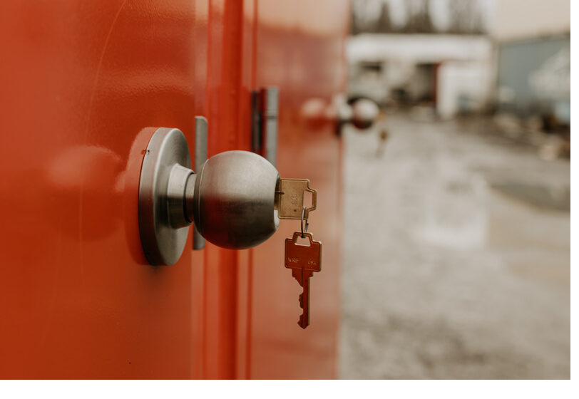 Close-up of a secure keyed door lock on a restroom trailer